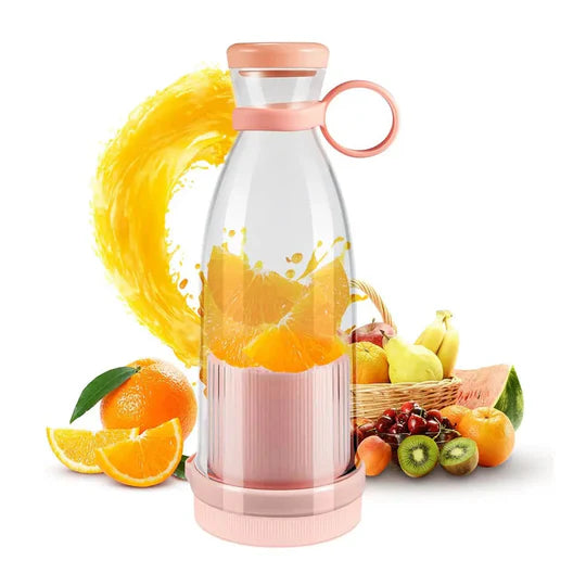 Pink and clear portable blender with fruits on a white background